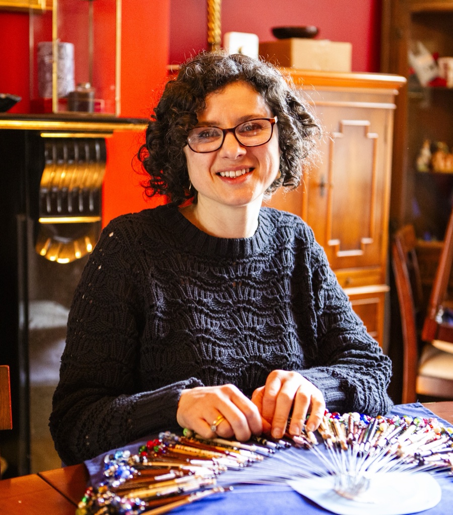 Caroline West with her lace bobbins